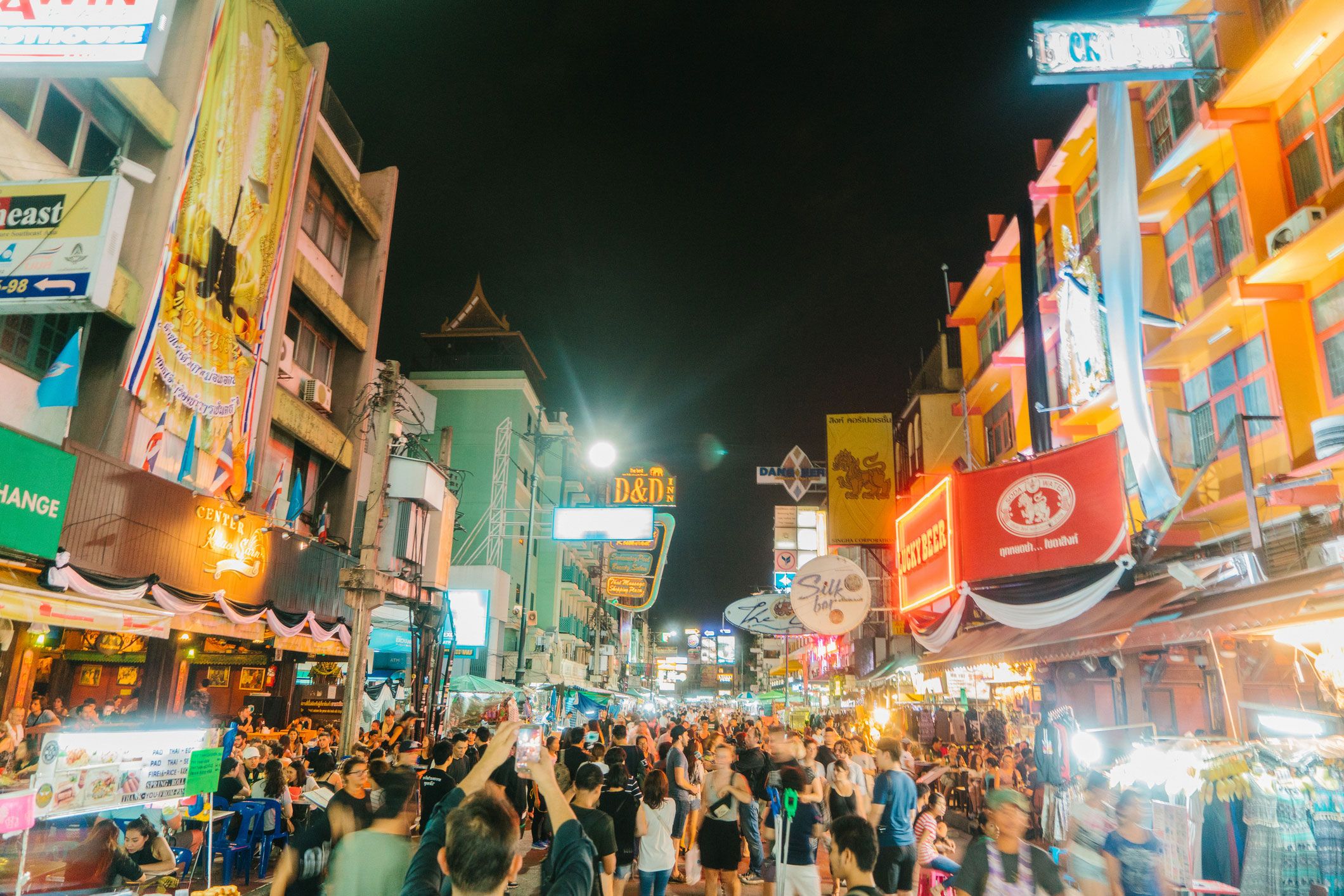 Crowded nightlife atmosphere on Khao San Road in Bangkok