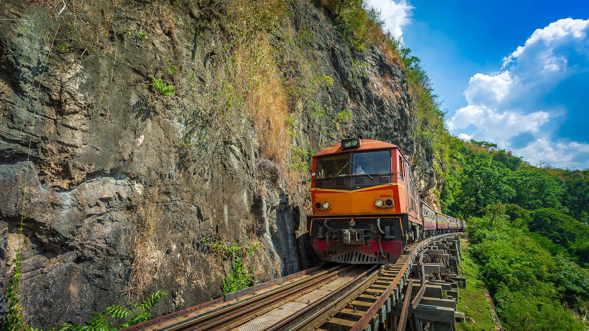 Beautiful view of the death railway with train in Kanchanaburi, Thailand