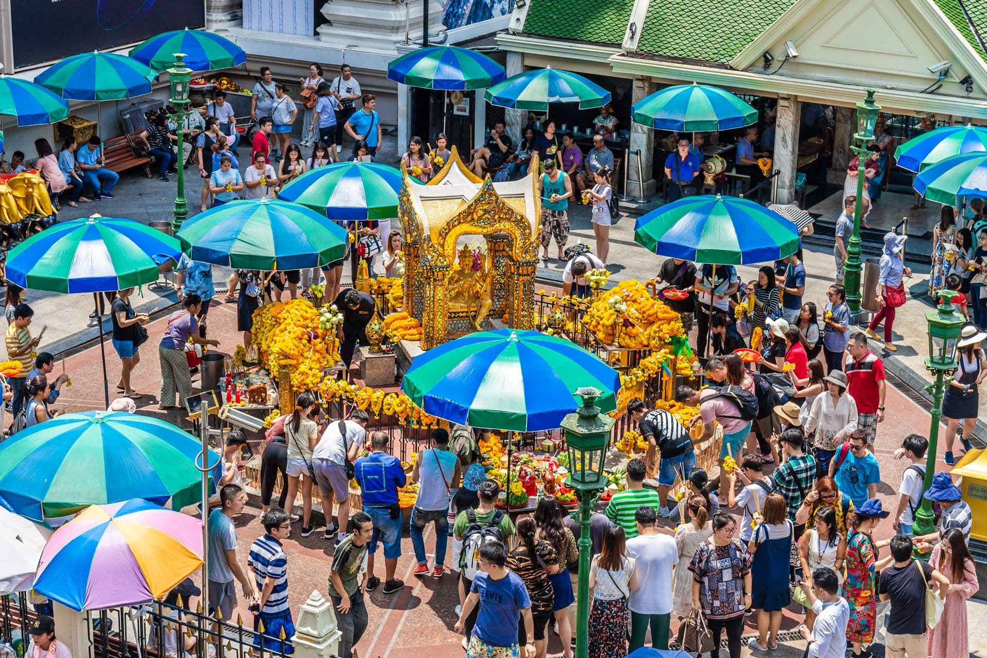 Erawan Shrine surrounded by modern Bangkok buildings