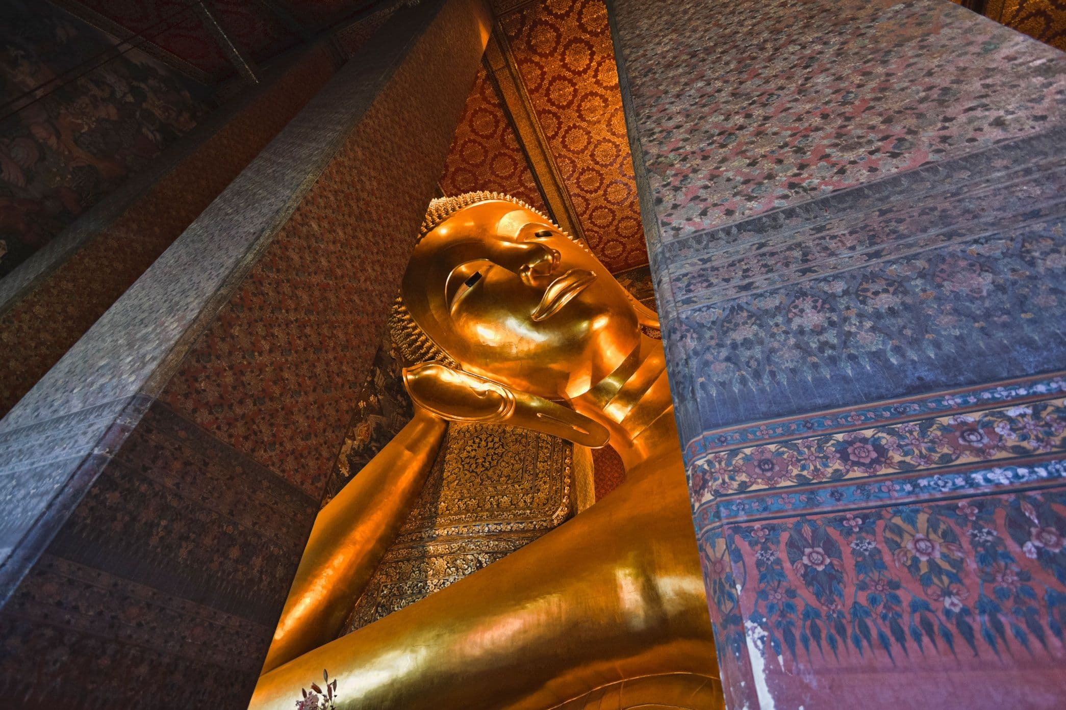 The giant Reclining Buddha inside Wat Pho in Bangkok
